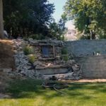 stone retaining wall with waterfall