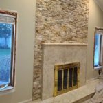 indoor fireplace with white mantel