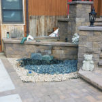 stone retaining wall with water