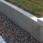 A concrete residential retaining wall